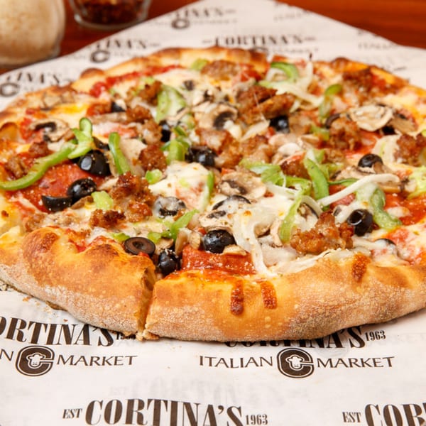 A Cortina's Italian Market & Pizzeria pizza with pepperoni, sausage, olives, mushrooms, and peppers.